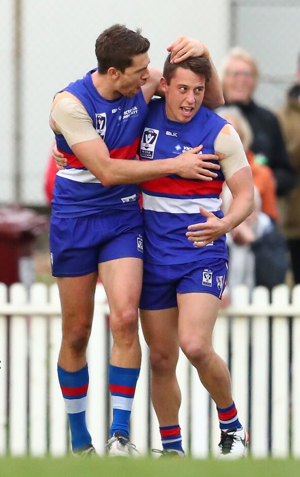VFL 2016 2nd Semi Final - Footscray v Essendon MELBOURNE, AUSTRALIA - SEPTEMBER 11: Nathan Hrovat of the Footscray Bulldogs is congratulated by his teammates after kicking a goal in the final quarter during the VFL 2nd Semi Final match between Footscray Bulldogs and Essendon at North Port Oval on September 11, 2016 in Melbourne, Australia. (Photo by Scott Barbour/AFL Media)